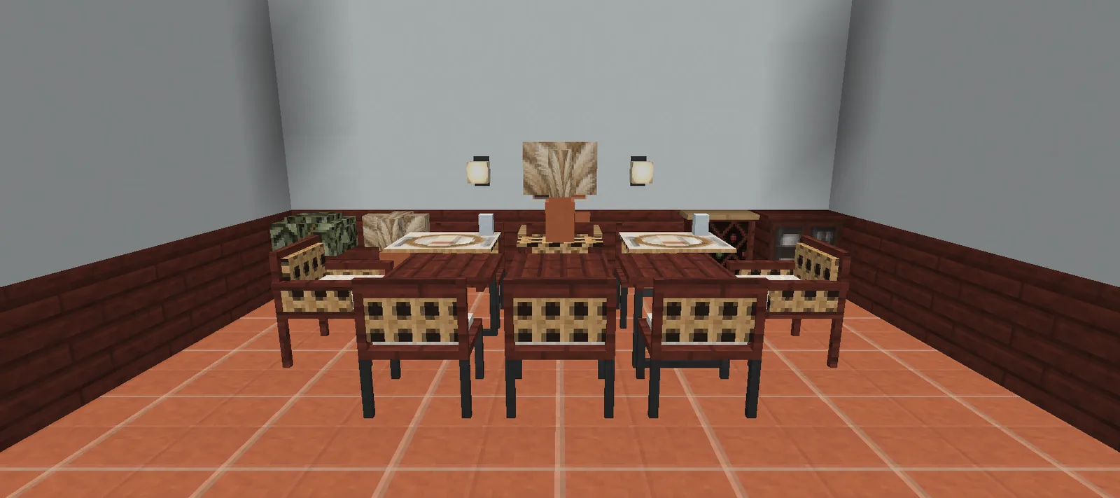 A modern Minecraft dining room with terracotta tile, a long table with table settings and a pampas centerpiece, cane chairs and armchairs and a cane sideboard